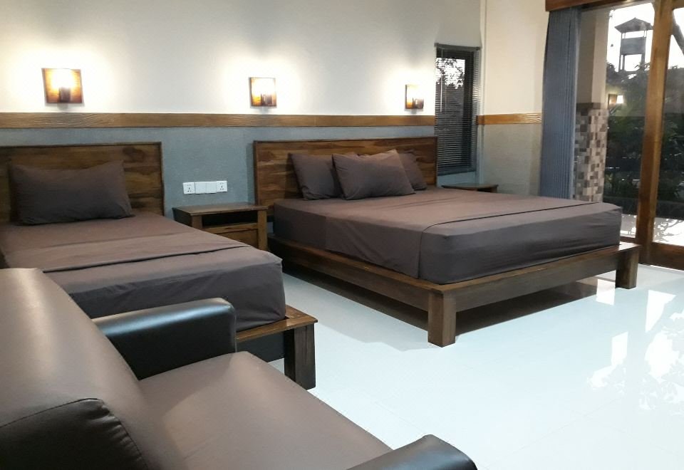 Puri Bali Hotel garden and pool area